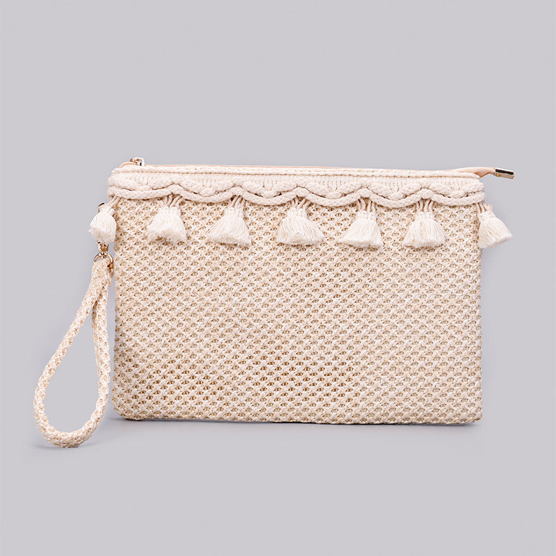Woven Straw Clutch with a macrame tassel, and removable woven straw wristlet and fully lined front view