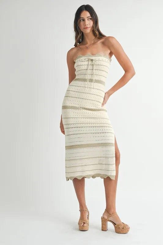Model wearing light taupe crochet midi dress with scalloped trim
