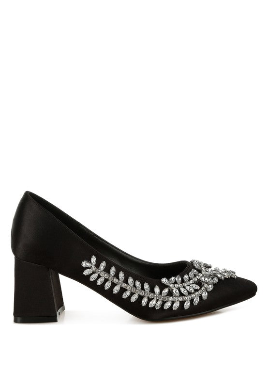 Side view of black satin pointed-toe heel with crystals
