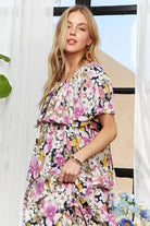 Close-up of off shoulder floral maxi dress with layered ruffles
