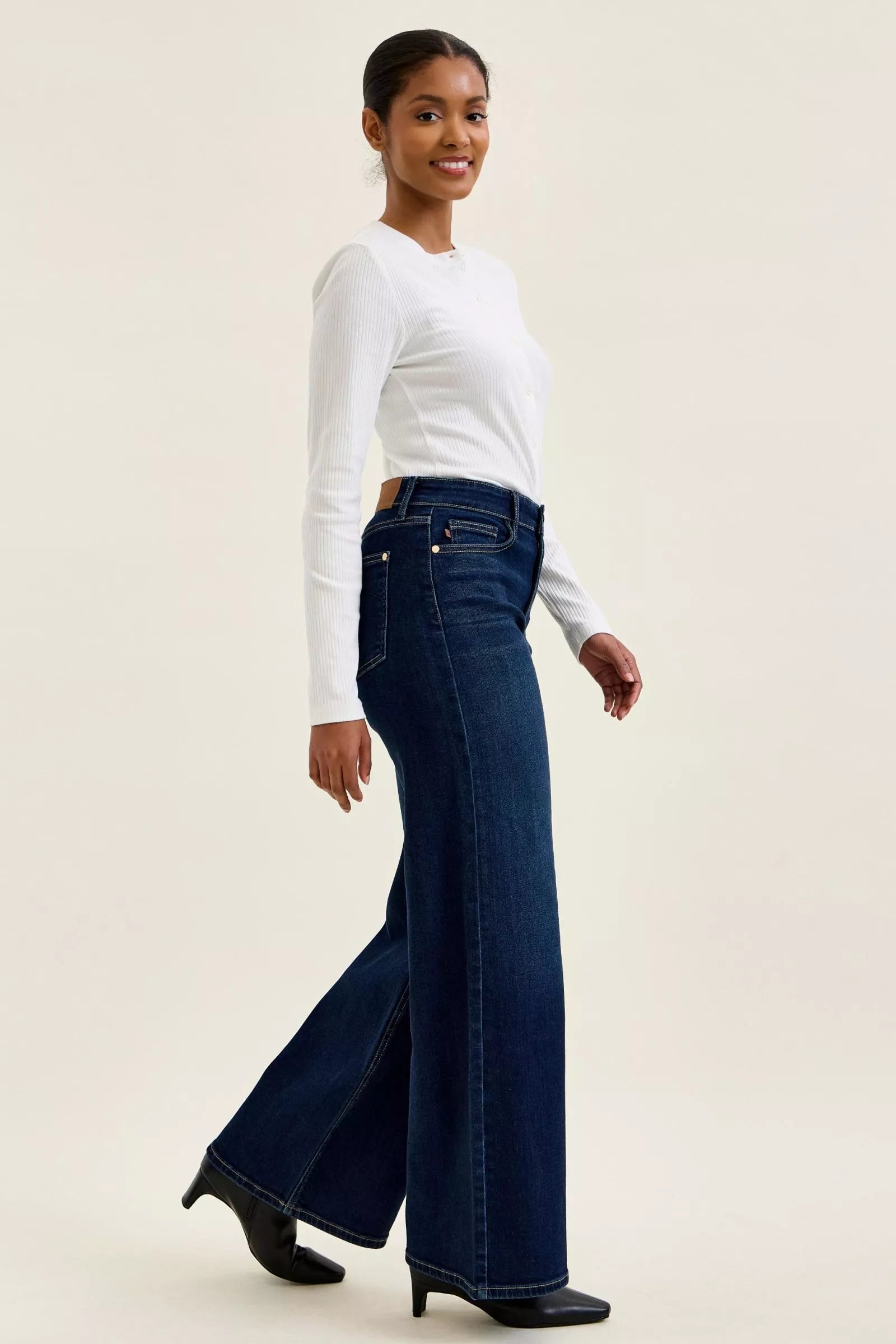 Going Places High Rise Wide Leg Jeans in dark indigo wash, side view walking