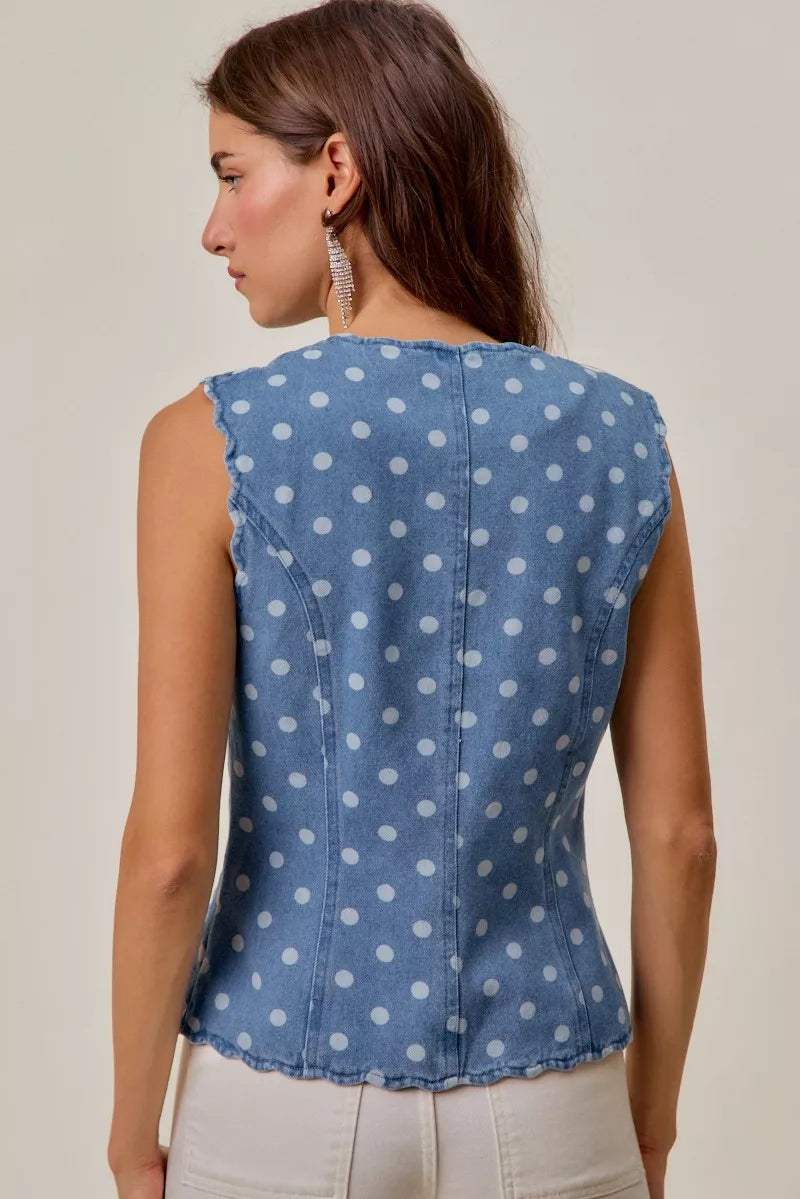 Back view of sleeveless blue denim polka dot vest
