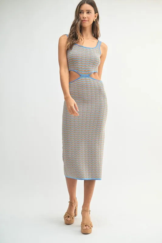 Full length view of striped cutout midi dress with platform heels
