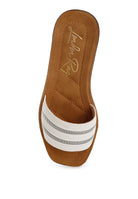 Overhead view of white slides showcasing square open toe and soft insole.