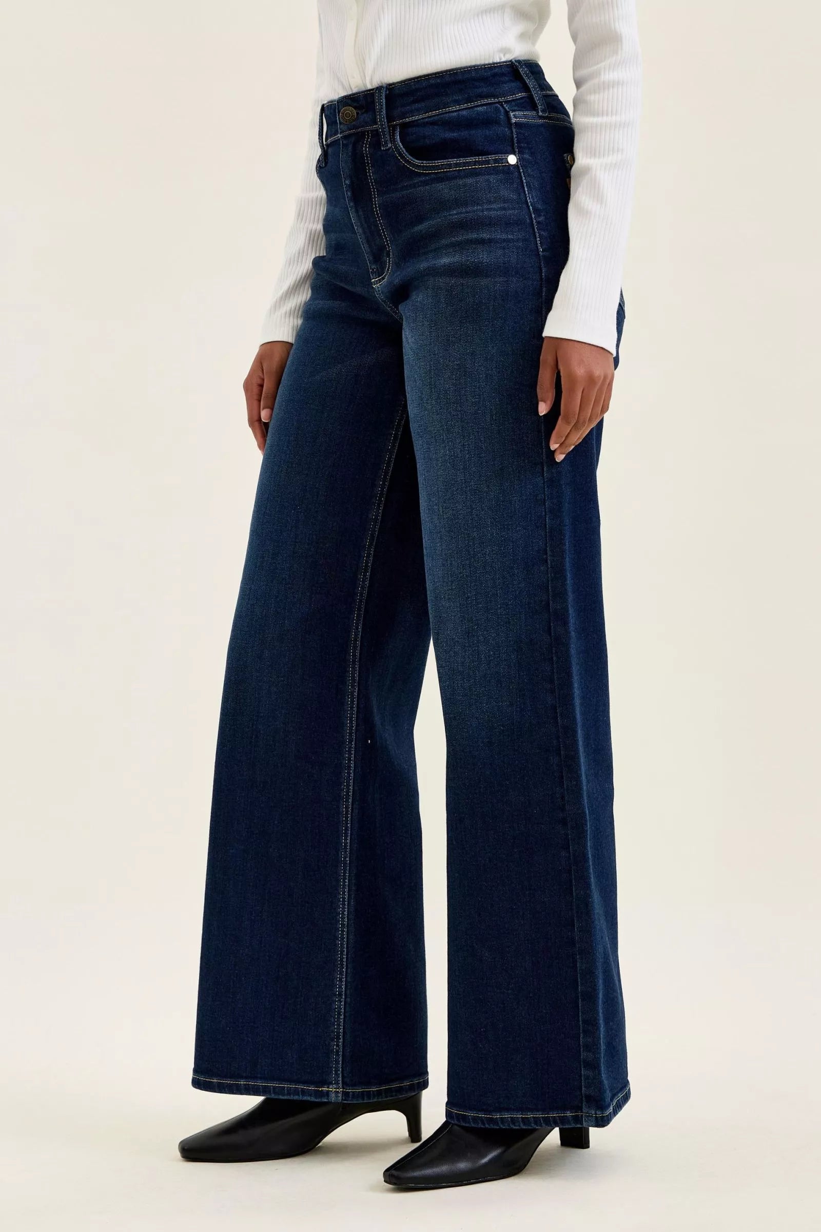 Going Places High Rise Wide Leg Jeans in dark indigo wash, side view close up
