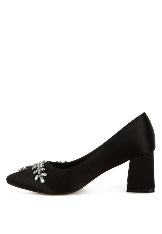 Side view of black satin pointed-toe heel with crystals
