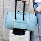 AVAH-Weekend Bliss Quilted Travel Bag in blue featuring a timeless design with vegan leather accents, Exterior open side pocket, luggage/trolley sleeve, shoe compartment, zip pocket and gold hardware