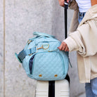 AVAH-Weekend Bliss Quilted Travel Bag in blue featuring a timeless design with vegan leather accents, Exterior open side pocket, luggage/trolley sleeve, shoe compartment, zip pocket and gold hardware