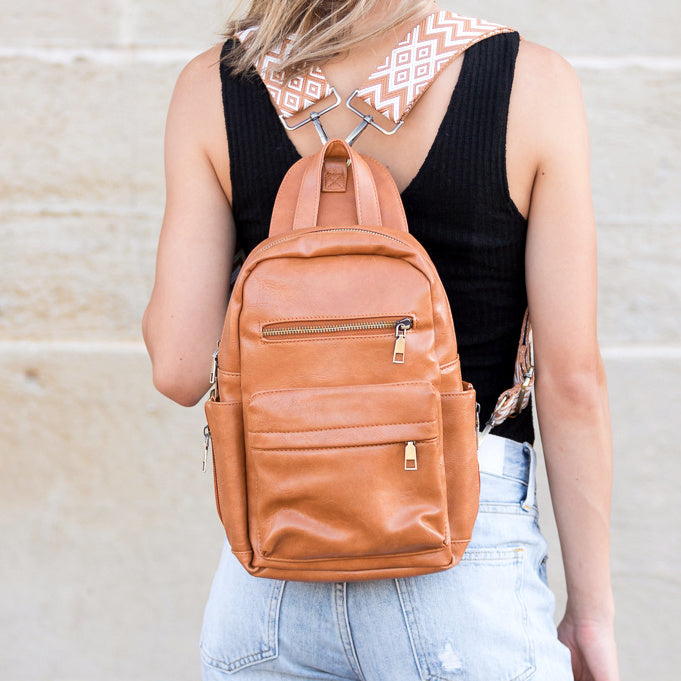 AVAH - cognac convertible backpack with adjustable patterned straps and front zip pockets