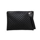 Black quilted clutch made with a premium soft quilted PU leather and cotton Herringbone print lining with grommet detail and wristlet.