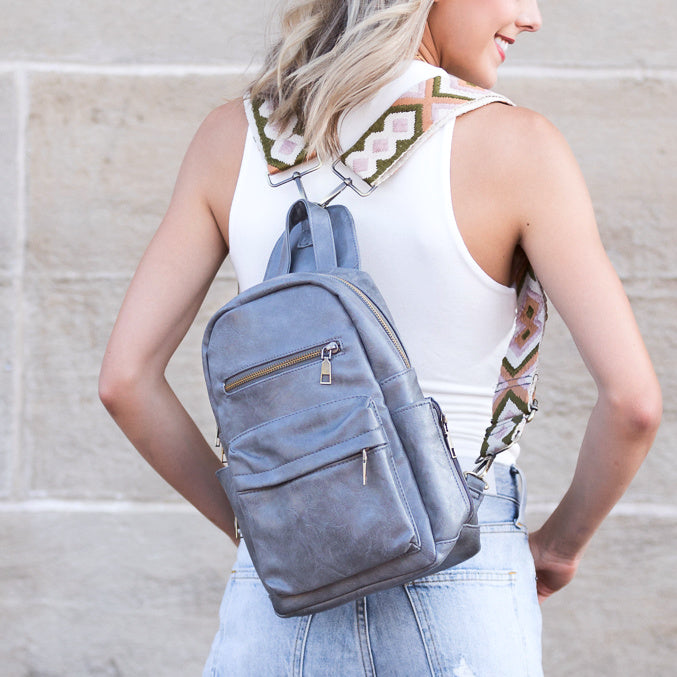 AVAH - gray convertible backpack with adjustable patterned straps and front zip pockets