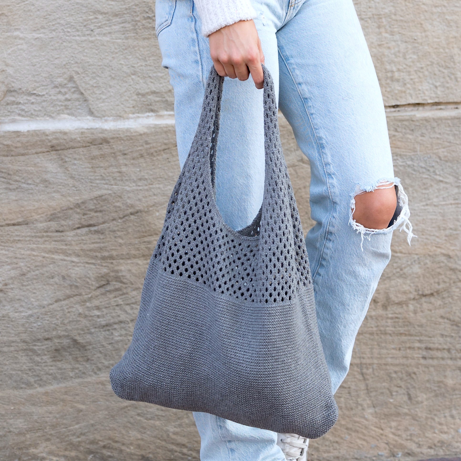 Soft-knit woven Hobo bag with open design in light gray