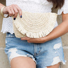 Frayed edge straw clutch with lined interior in Natural color