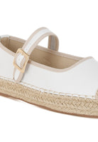 Close-up of buckle strap and white leather upper