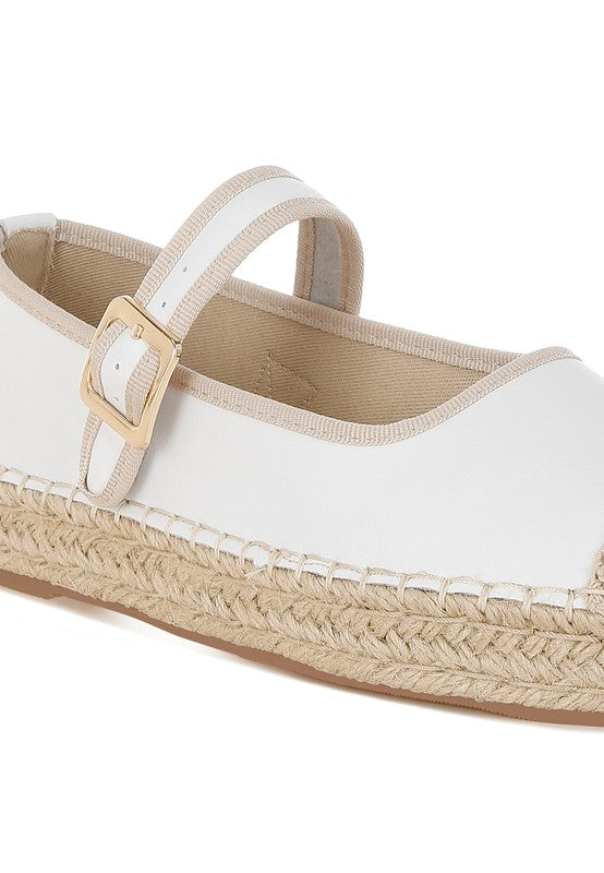 Close-up of buckle strap and white leather upper
