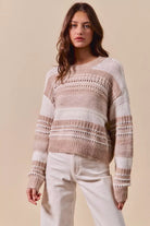 Sandstone Striped Open Knit Sweater in soft taupe and ivory with long sleeves and textured openwork stitching, front view.