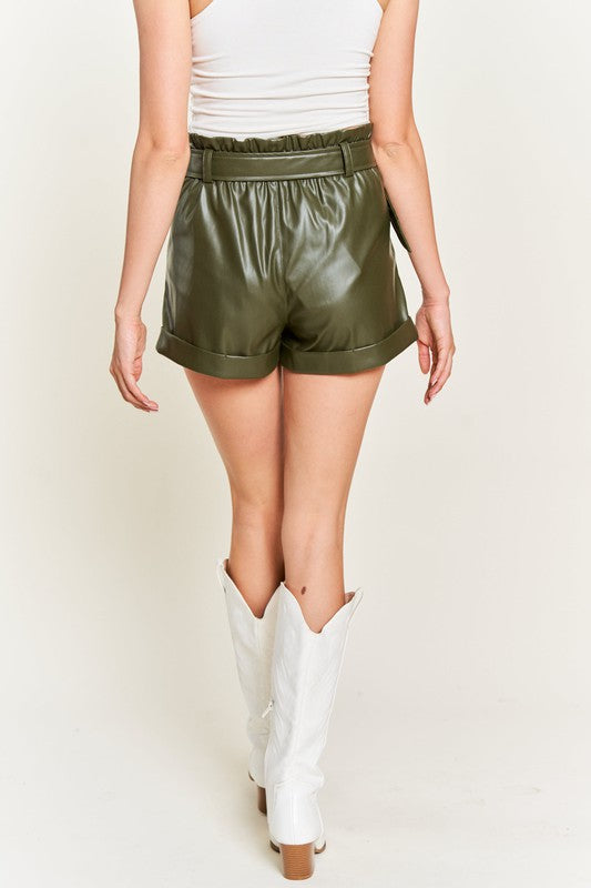 Back view of olive vegan leather shorts showing elastic waistband and cuffed hem