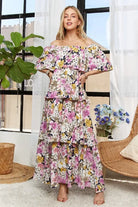 Full length view of feminine floral tiered maxi dress
