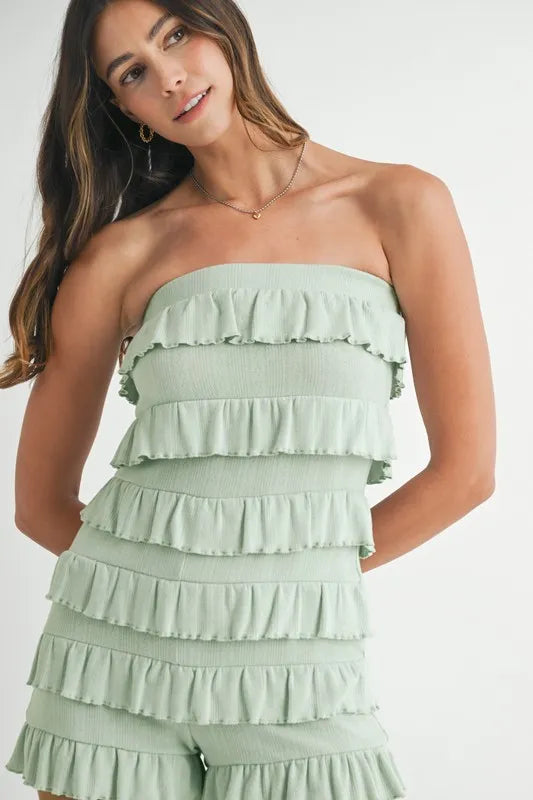 Close-up of sage green layered ruffle romper bodice
