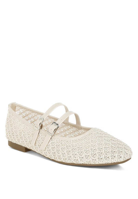 Front view of beige raffia ballet flats with rounded toe and faux leather straps.