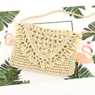 Close up of cream woven straw crossbody with fringe flap detail, front view-AVAH