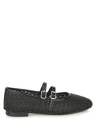 Black woven raffia ballet flats with faux leather straps and double buckle accents, side profile.