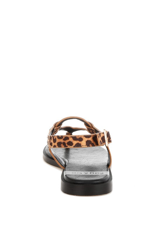 Back view of sandal with adjustable strap and gold buckle