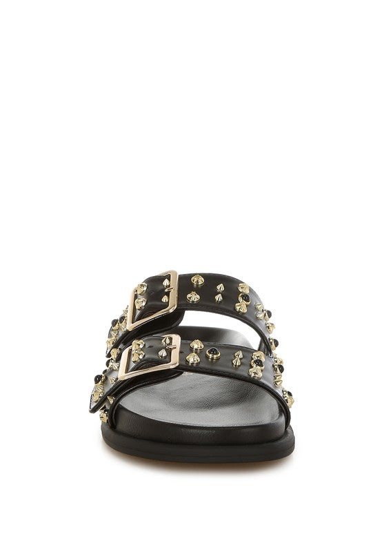 Front view of black studded slide sandal with gold buckles and rounded open toe