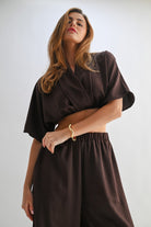 Cropped front view of chocolate lounge set showing soft shawl neckline and relaxed sleeves.