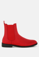 Red Chelsea boot on a white background
