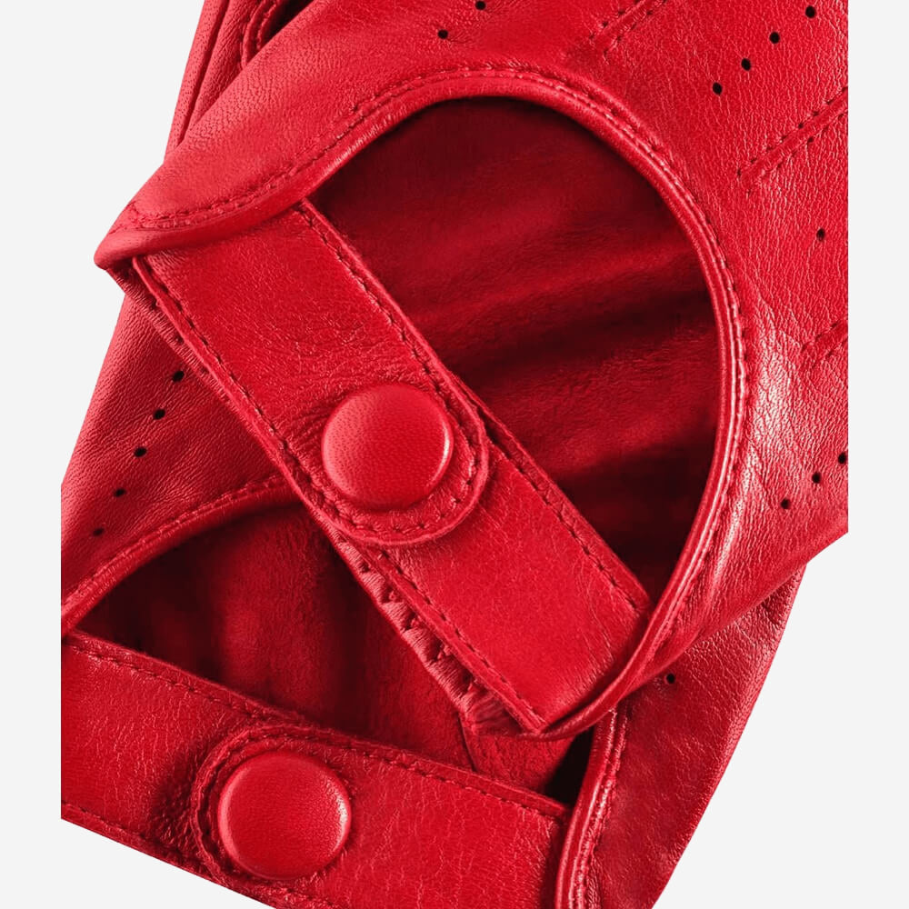 Close-up of a red glove with button straps on a white background