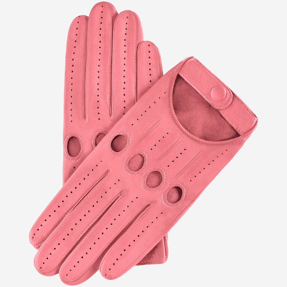 Pair of pink leather driving gloves on a light gray background
