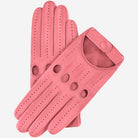Pair of pink leather driving gloves on a light gray background