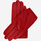 Pair of red leather gloves on a white background