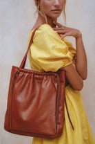 Alessia Leather Tote Bag in vintage camel handcrafted genuine leather worn over the shoulder by Bali ELF