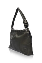 A black leather shoulder bag with a knotted handle detail, shown from a three-quarter angle on a white background.