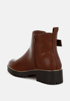 Brown leather ankle boot on a white background