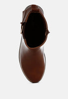Brown leather boot with buckle on a white background