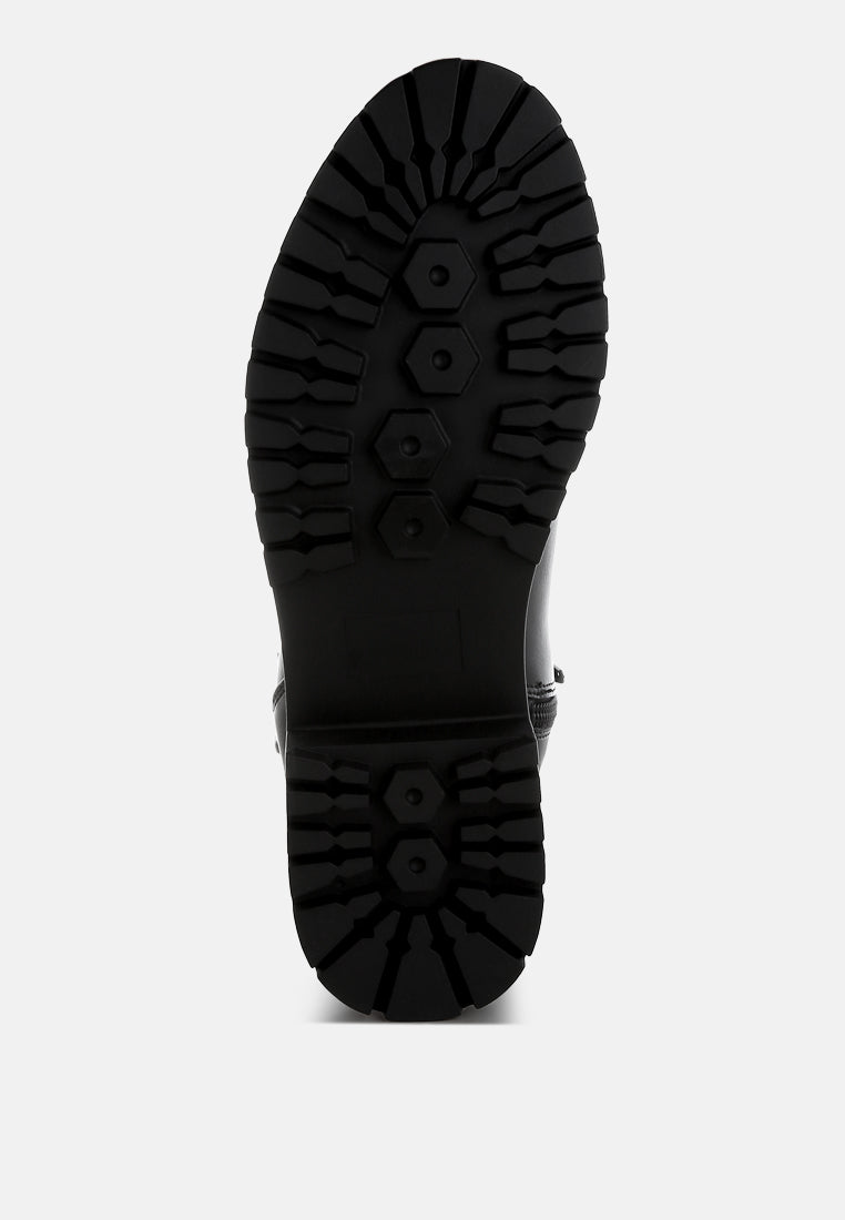 Black boot sole on a white background