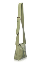 Olive green leather shoulder bag with a matching adjustable strap, featuring a tassel detail and decorative perforations on the front, shown against a plain white background.