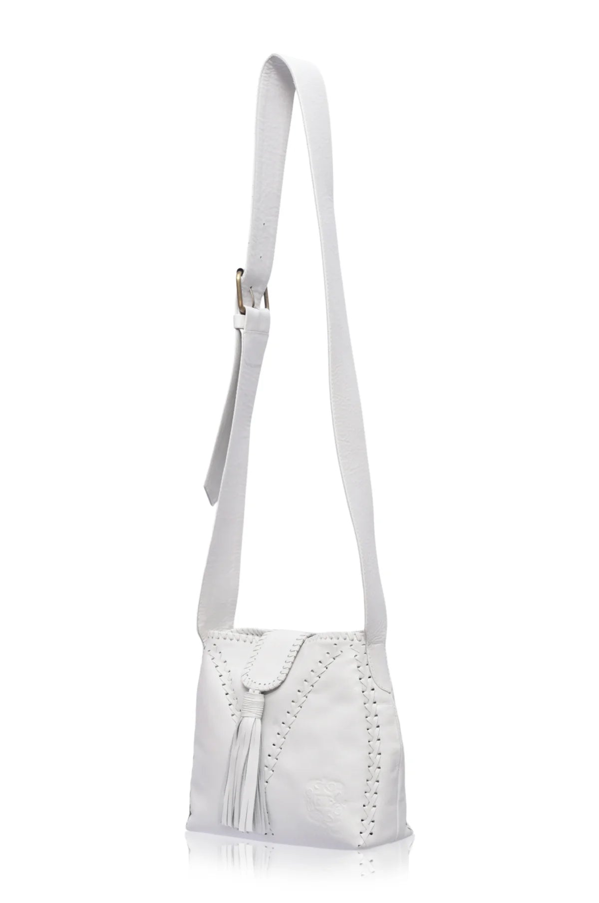 A white leather shoulder bag with a long strap, featuring a front flap with a tassel detail and decorative perforated stitching, shown against a plain white background.