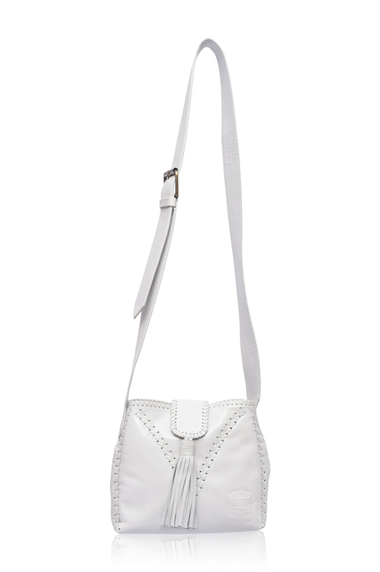 White leather handbag with fringe details and wide crossbody strap on a white background, front view