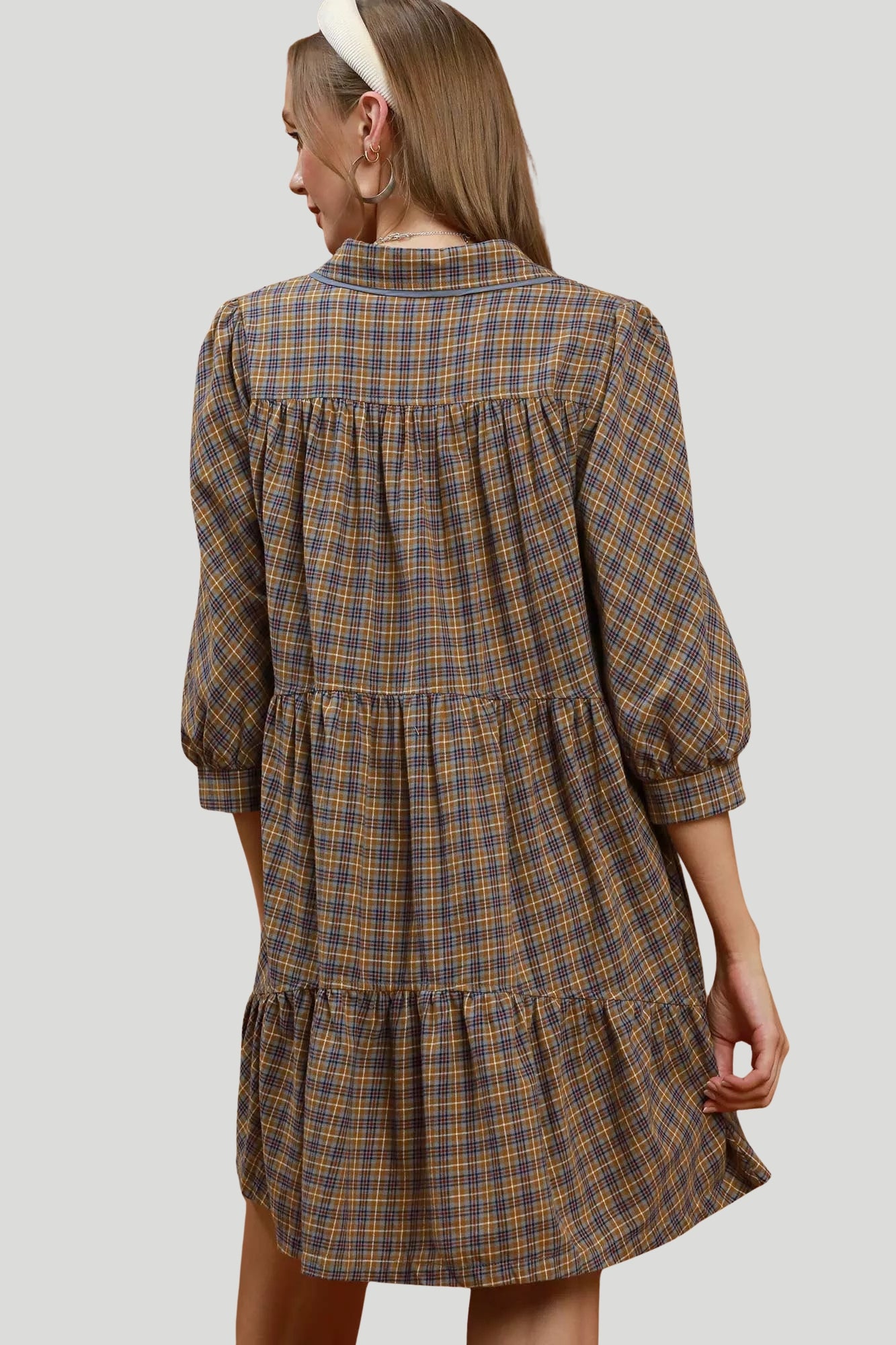 Back view of Autumn Row Plaid Shirt Dress showing gathered tiered design and three quarter sleeves.