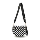 AVAH-a black and white checkered chic oversized sling bag with double zips and multiple pockets on a white background