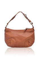 Camel leather handbag with short handle, hardware accents zipper top on a white background
