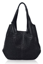 Black woven handbag on a white background