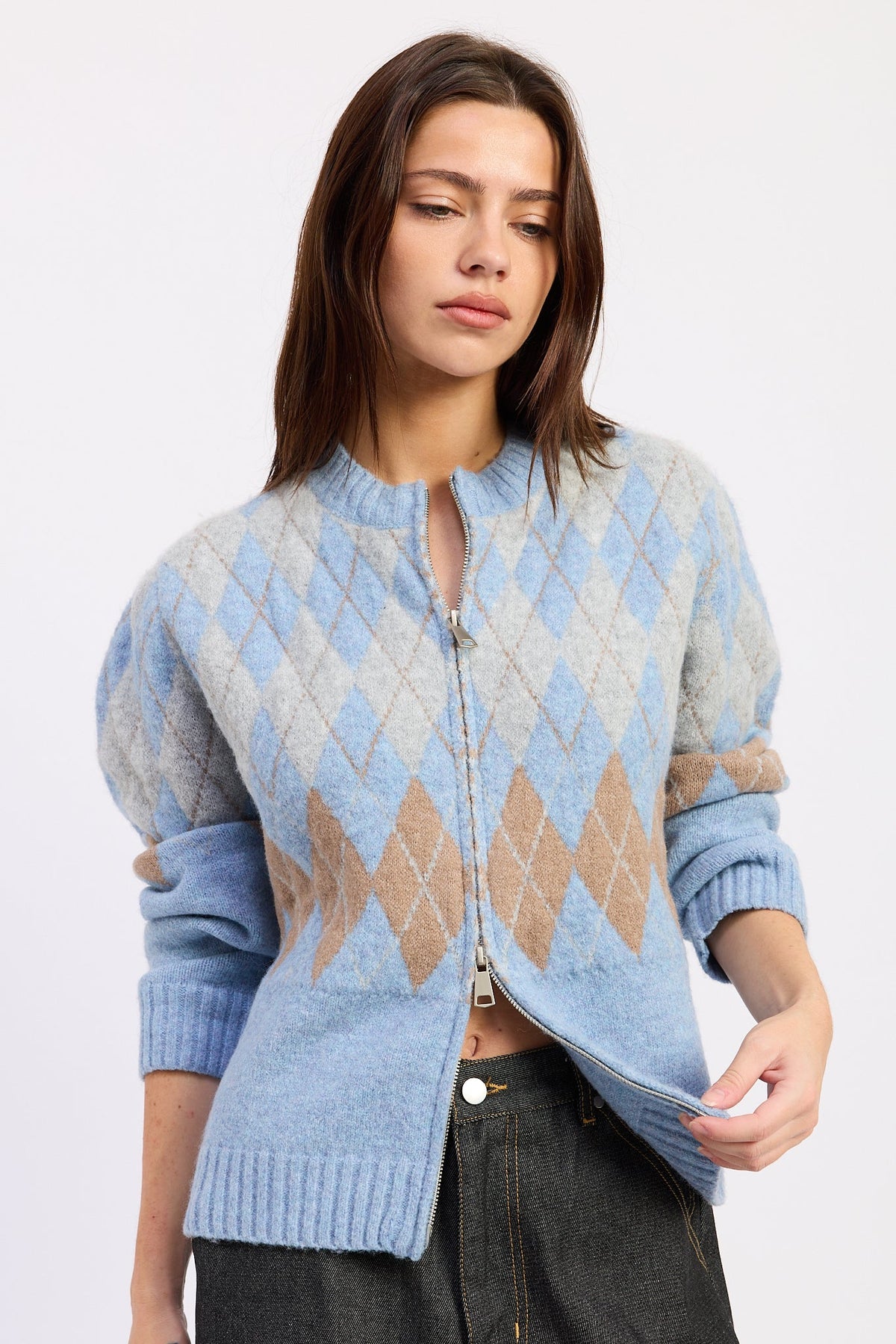 Front view of baby blue argyle zip cardigan with grey and camel diamond knit pattern and ribbed trim.