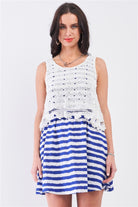 Front view of blue and white striped mini dress with white crochet overlay bodice
