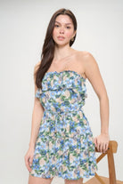 Close up of ruffled strapless neckline with blue floral print