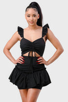Black mini dress with ruched sweetheart neckline and ruffle hem, front view
